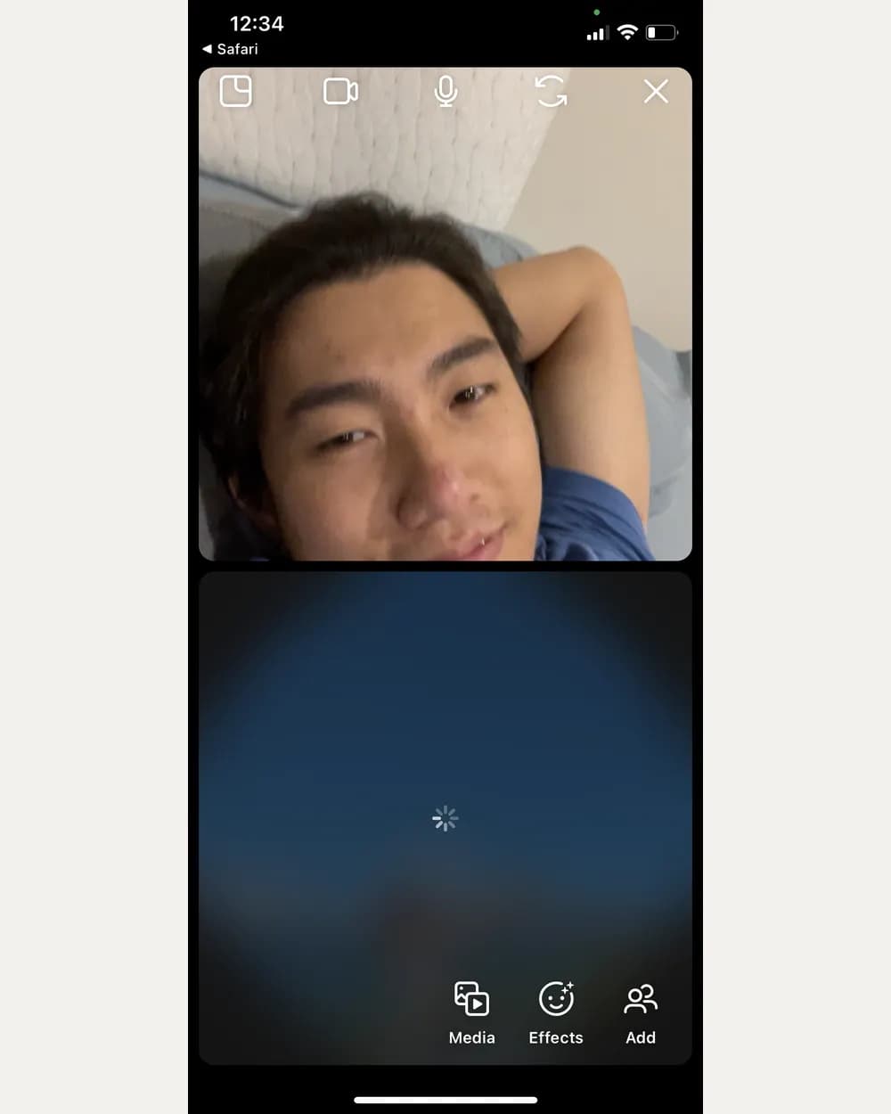 A screenshot of a video call at 12:34am: Tony lying in bed on the top half, and the bottom half a blank blue panel with a loading spinner where Jam's video should be