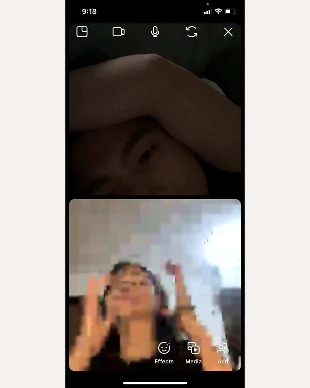 A screenshot of a video call at 9:18pm: Tony in the dark on the top half, and below him Jam waving with both hands, her video broken into large coloured blocks